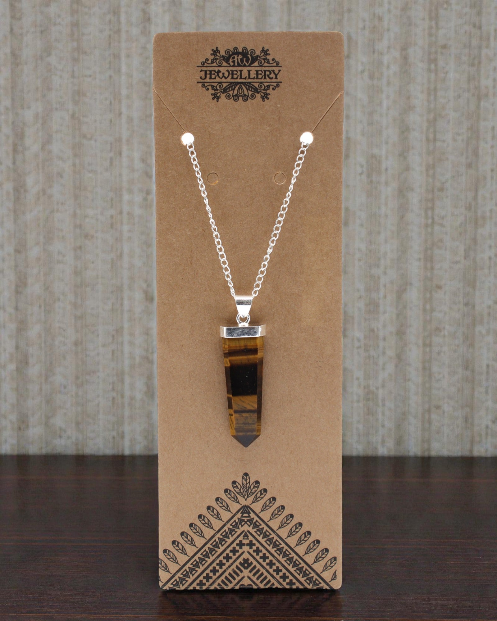 Fiamma di Tigre – Ciondolo piatto in occhio di tigre con taglio a cristallo