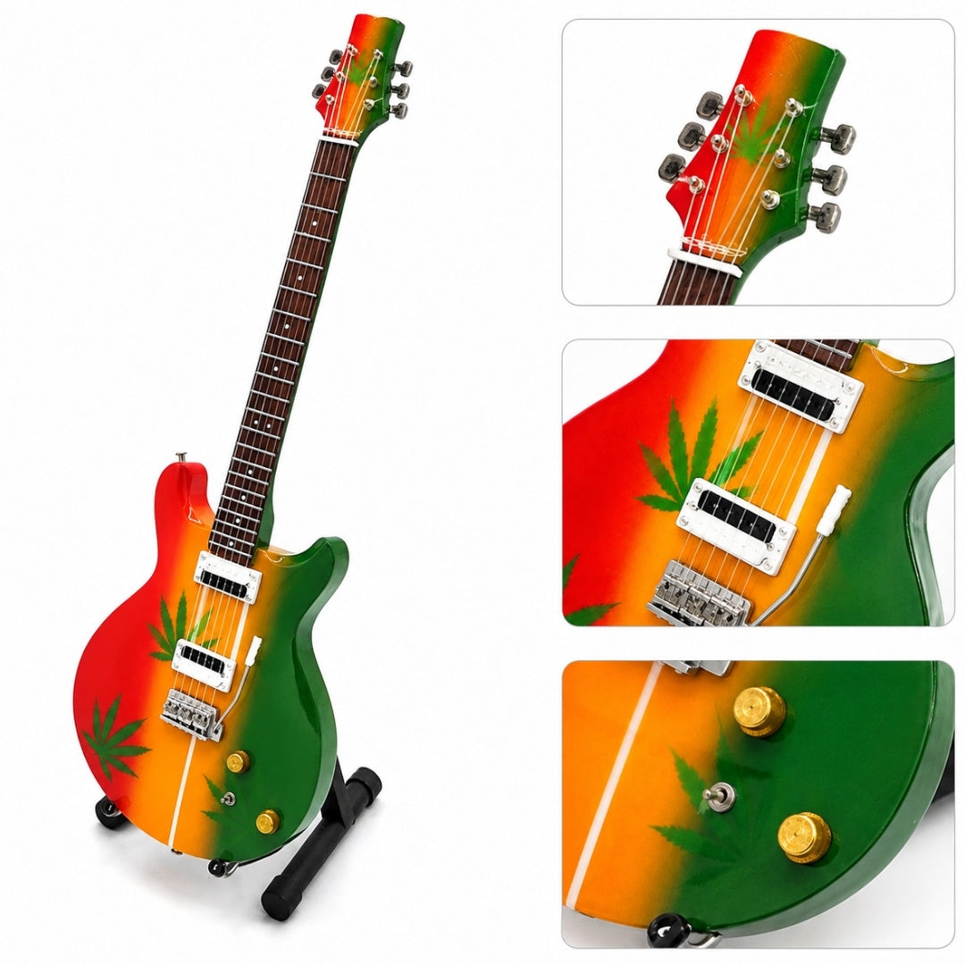 Mini chitarra Bob Marley Tribute Ganja MGT-0468 con possibilità di incisione personalizzata, regalo ideale per fan del reggae, realizzata a mano in legno di mogano, altezza 27,5 cm, colori giallo, rosso, verde, bianco