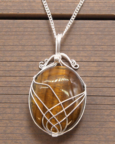Ricciolo del Potere – Collana con occhio di tigre intrecciata a mano